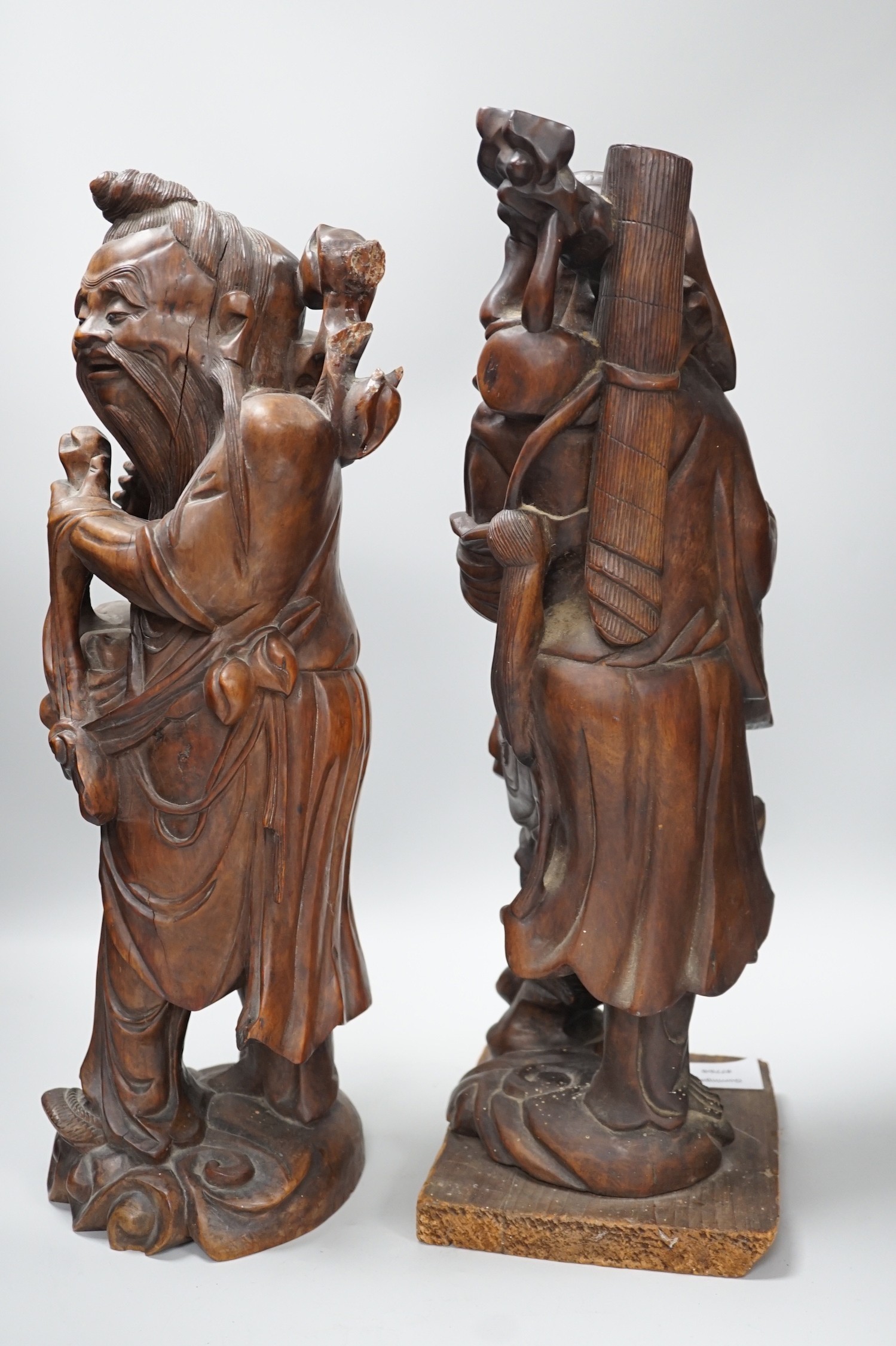 Two Chinese hardwood figures of luohans, early 20th century Tallest 48cm